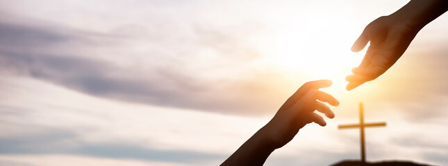the hand of god helping and giving hope, in a background with the cross of christ © Jess rodriguez
