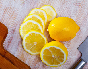 Lemon slices on wooden cutting board. High quality photo