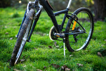 Fototapeta na wymiar Bicycle rides, travel, outdoor activities. The bike is on the green grass.