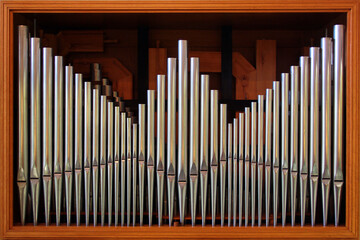 Organ pipes as background. Catholic classical music instrument in a church
