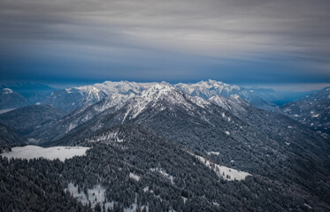 Fototapeta na wymiar Skiing in Italy, Dolomites, Madonna di Campiglio, Pinzolo. Cloudy winter day in January 2023