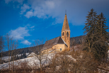 Small church in St. Magdalena or Santa Maddalena in Geislergruppe or Gruppo dele Odle Italian Dolomites Alps mountains. January 2023
