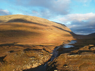 An aerial panorama of the hiking trail between Viterskalet and Syter Mountain Huts, October, Swedish Lapland