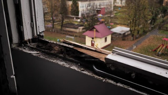 An Employee Removes An Old Wooden Window.