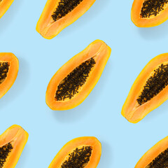 Fresh ripe papaya seamless pattern on white background. Tropical abstract background. Top view. Creative design, minimal flat lay concept. Trend tropical fruit food background pattern