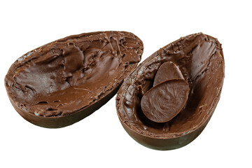 Two halves of chocolate Easter egg, on a small old tray. Stuffed with small choclolates.