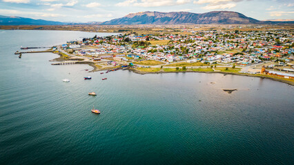 City of Puerto Natales Chile, Aerial Drone Above Town Buildings Amongst Patagonian Landscape of...