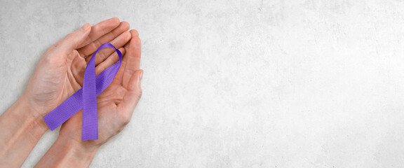 Purple Ribbon in Hands, Alzheimer's, Domestic Violence Concept with Copy Space
