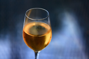 a glass of white wine in a restaurant, alcohol luxury background