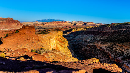 Fototapeta na wymiar View of the Red Sandstone rock formations surrounding Sulphur Creek Canyon at Sunset Point in Capitol Reef National Park, Utah, USA