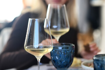 a glass of white wine in a restaurant, alcohol luxury background