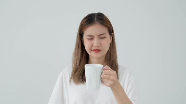 Asian woman feel sensitive teeth after drinking hot, female suffer tooth, decay problems, dental care, tooth extraction, decay problem, bad breath, Gingival Recession, Oral Hygiene instruction