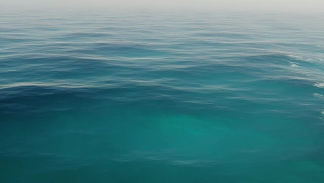 CGI, Blue Ocean Surface With Calm Waves At Daytime. Seamless Loop. pullback