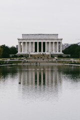 Fototapeta na wymiar Washington D. C. United States. November 29, 2022: abraham lincoln monument on a gray day and reflection in the water.