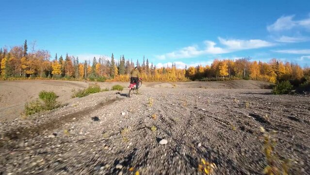 Two brothers riding dirt bikes with FVP drone