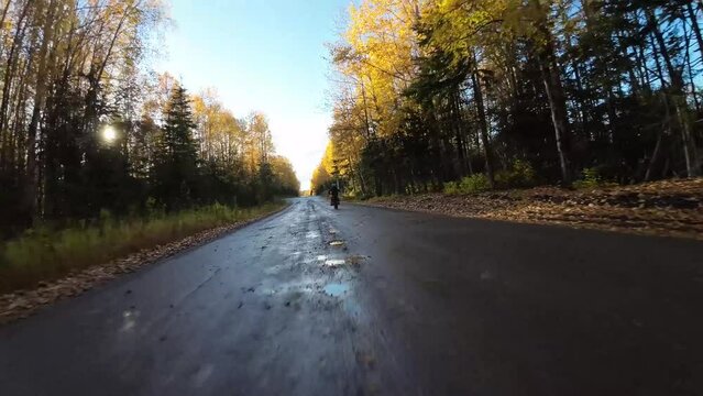 Two brothers riding dirt bikes with FVP drone