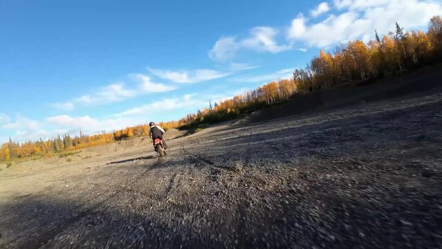 Two brothers riding dirt bikes with FVP drone