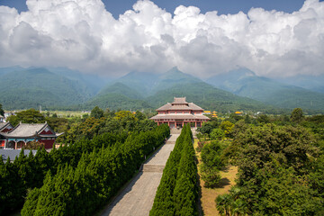 Chinese traditional pagodas and old buildings in a sunny day with mountains and blue sky on...