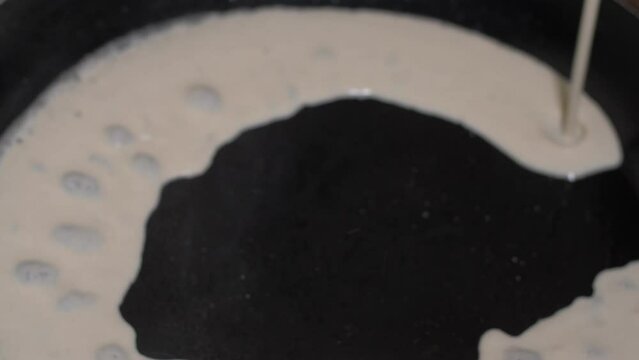 Ramadan Food in Yemen Enjera poured on hot plate mixture