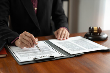 Fototapeta premium Female lawyer, legal consultant, asian businesswoman checking documents before signing venture capital business finance legal services concept in office.