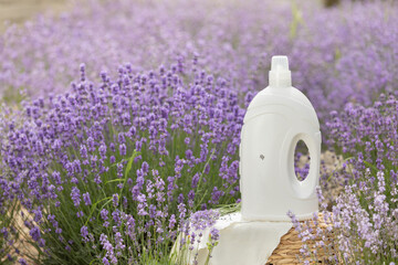 Fabric softener with lavender scent. Fragrance in a field with purple flowers.