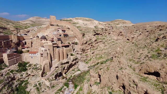 bethlehem, Palestine: The Greek Orthodox Mar Saba monastery in the Judean desert outside bethlehem in Palestine. Shot with a panoramic motion. 