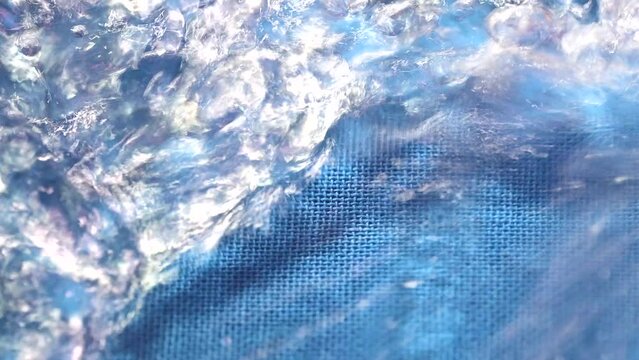 The water is moving in a wave pattern and reflecting
