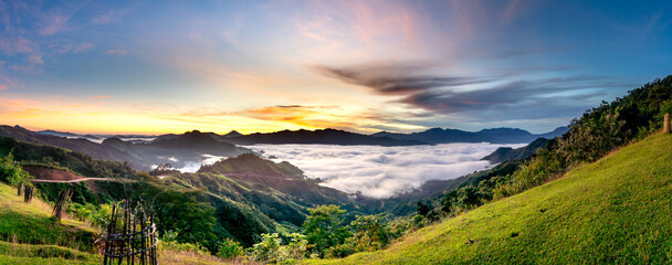 Panoramic view of sunrise with a trail going through a valley filled with white clouds in the Tak Po mountains in Tra Tap commune, Nam Tra My district, Quang Nam province, Vietnam