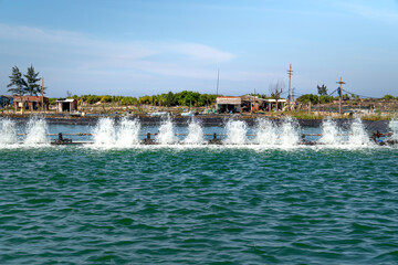 A fan system to create oxygen for fisherman's shrimp pond in Hoi An, Quang Nam, Vietnam
