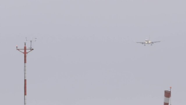 Aircraft Arriving In The Gdansk Lech Walesa Airport On A Misty Day In Gdansk, Poland. - wide