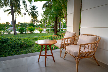 two bamboo and rattan chairs to relax at Pax Ana 4-star resort in Doc Let beach, city Nha Trang street, VN