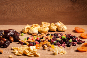 Dried fruits on wooden background in studio photo