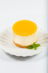 Creamy petite mango cheesecake with mango jelly and a wholewheat biscuit crumb base.