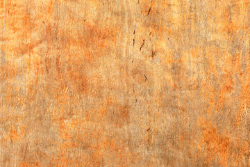 Close-up of a sheet of wooden plywood with traces of corrosion.