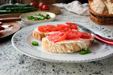 Close-up of fresh cherry tomatoes bruschetta with cream cheese.