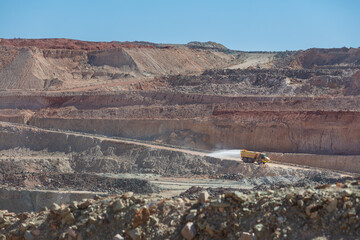Water truck spraying at a mine site in Australia in order to keep the dust under control