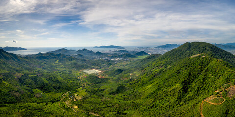 Panoramic photo of dawn viewed from the high mountains, in the distance is the famous coastal tourist city of Nha Trang, Khanh Hoa province, Vietnam