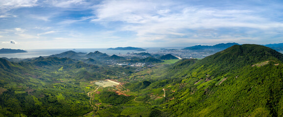 Panoramic photo of dawn viewed from the high mountains, in the distance is the famous coastal tourist city of Nha Trang, Khanh Hoa province, Vietnam