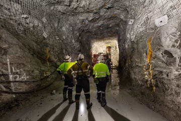 Miners underground inspecting work in progress at a mine site in Australia © Michael Evans