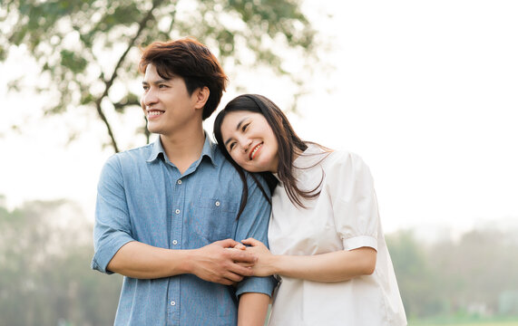 image of a happy asian couple in the park