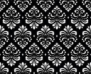 Floral pattern. Vintage wallpaper in the Baroque style. Seamless vector background. White and black ornament for fabric, wallpaper, packaging. Ornate Damask flower ornament