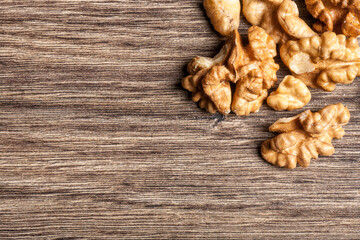 Raw organic nuts on wooden background with copy space available. Studio photo