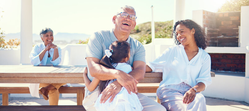 Family, Outdoor And Laughing On Vacation With Child, Mother And Grandpa On A Bench With Love And Care. Girl, Woman And Man Or Grandparents Happy In Summer For Hug, Fun And Happiness On Holiday Patio