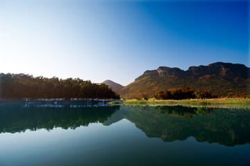 landscape of lake and mountain with clear blue sky in the morning