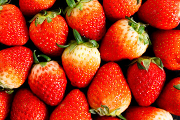 Ripe red strawberries background.