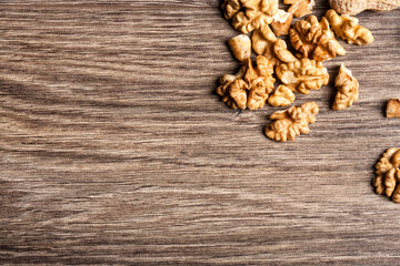 Obraz na płótnie Canvas Nuts on wooden background in close up photo