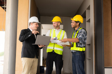 Three colleagues discussing data work and tablet Laptop with architecture project at construction site Architect team working on blueprints for architectural plans construction project engineer