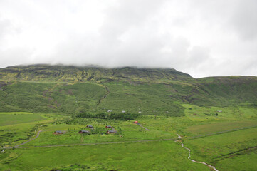 Scenic view of a river flowing between grass valleys in Iceland