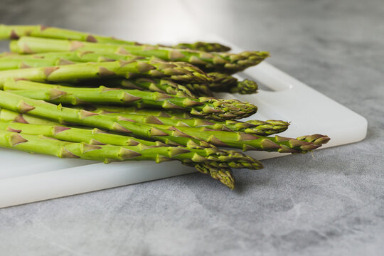 Green asparagus close-up on a cutting board
