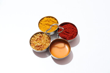 Traditional Hindu Pooja Essential items, Bannana leaf,Turmeric, Kumkum, Mari gold flower Isolated on White Background